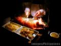"Lechon de Leche or Roasted Suckling Pig",
Photographer/Artist: Willy Lorenzana,
Date Taken: 2005,
Place Taken: Antonio's, Tagaytay, Cavite